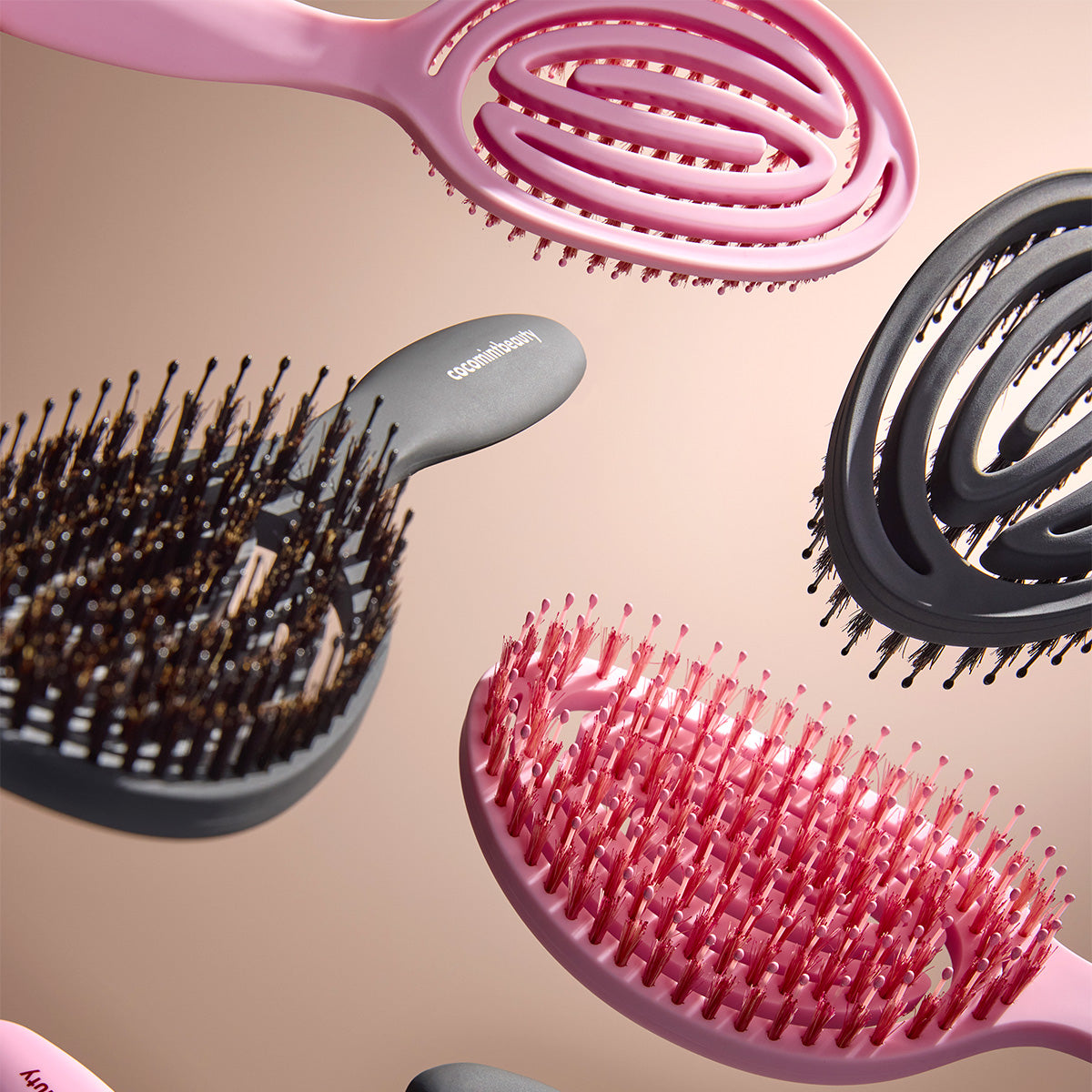 Set of Cocomint Beauty boar's hair bristle brushes in assorted colors and designs