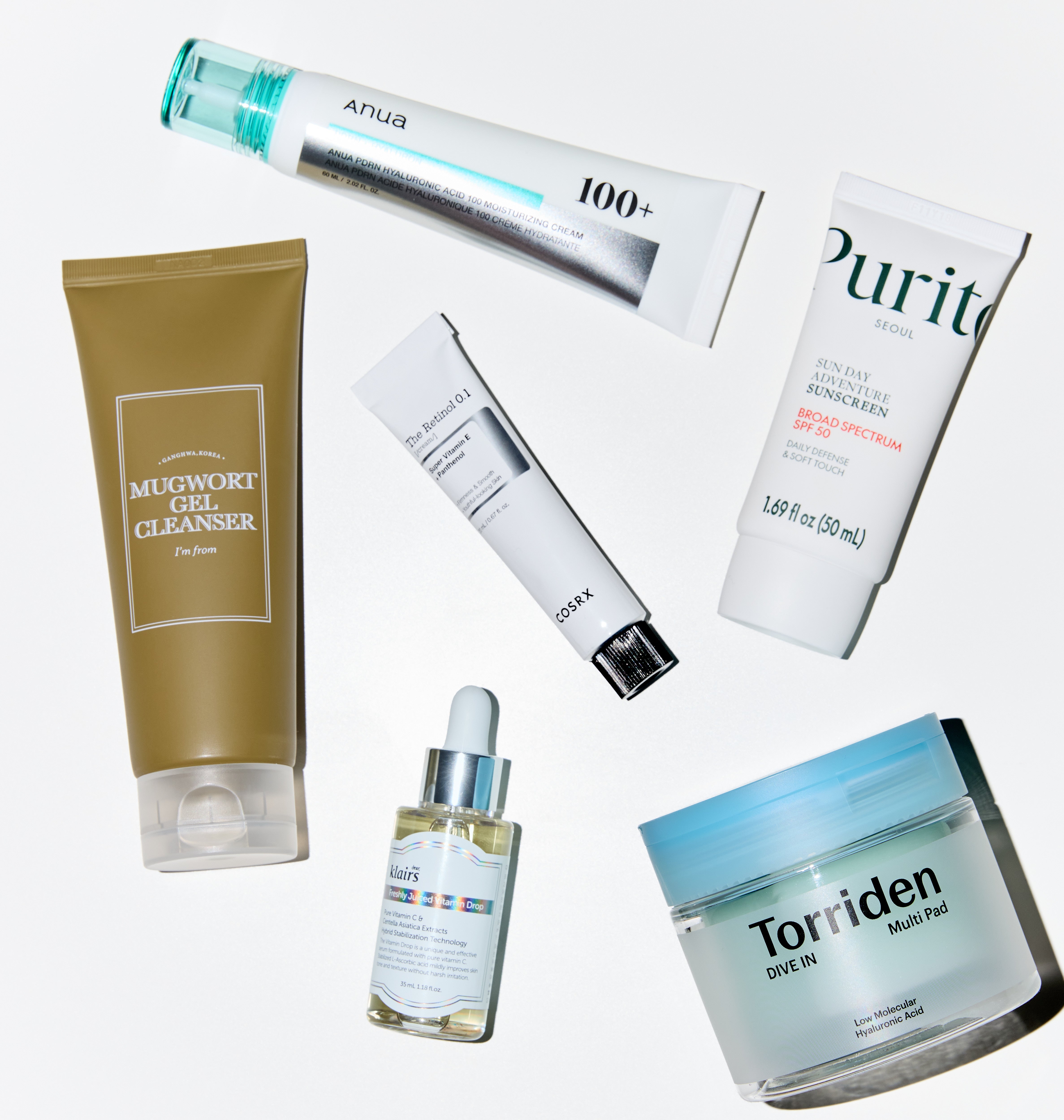 Collection of skincare products with visible brand names on a white background