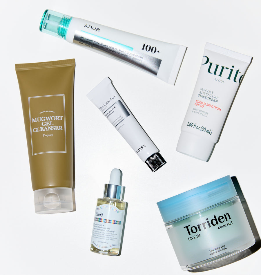 Collection of skincare products with visible brand names on a white background