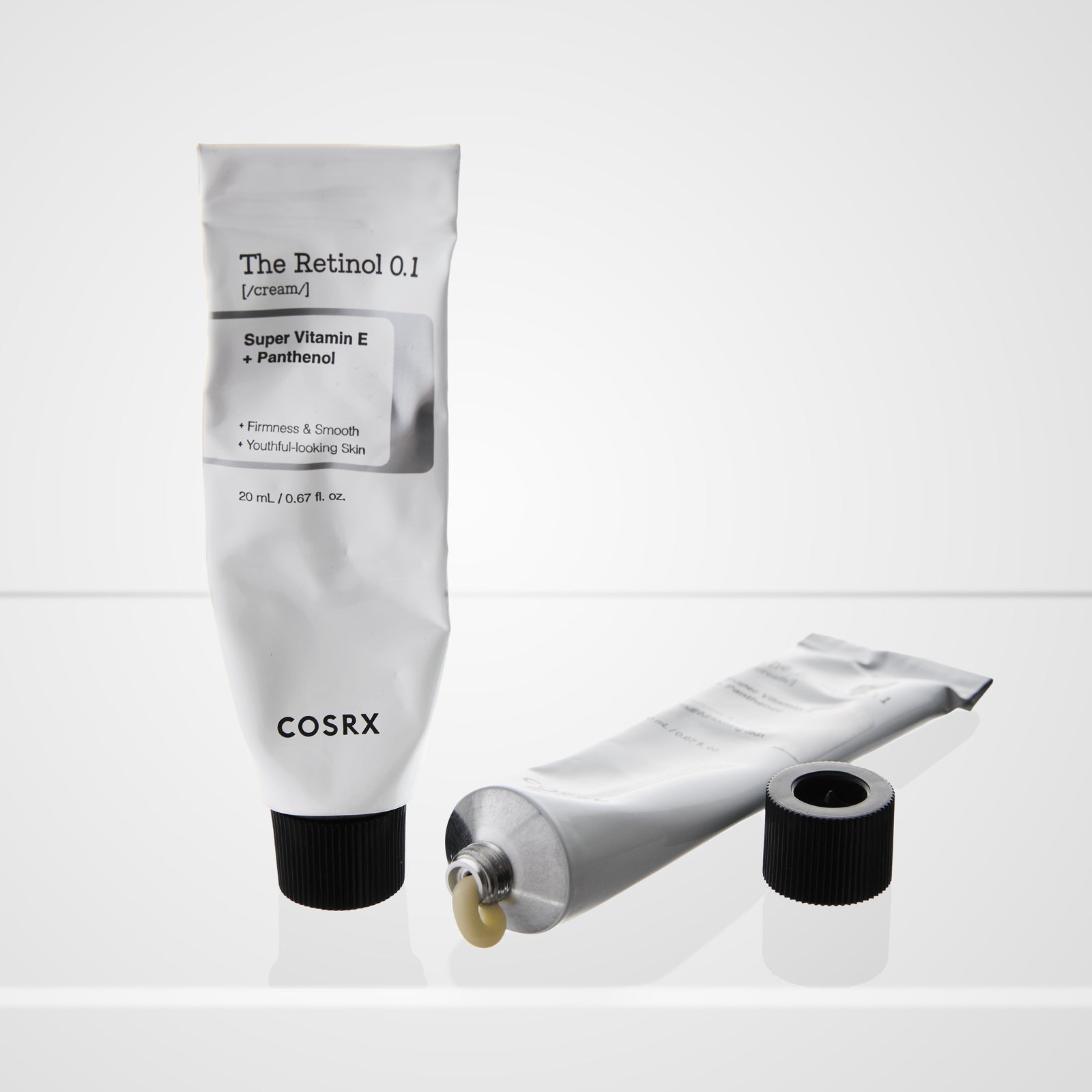 Cosrx skincare product with open cap on a white background
